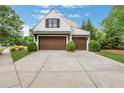 Spacious two-car garage with wooden doors, modern lighting, and ample driveway space at 3920 Cash Lndg, Marietta, GA 30066