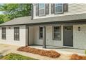 A covered front porch with stone accents provides a welcoming entrance to this charming two-story home at 1758 Bridgestone Ct, Marietta, GA 30066