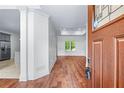Inviting foyer with hardwood floors leading into an open-concept living area at 2400 Honey Ct, Mcdonough, GA 30252