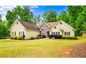 Charming one-story home featuring a stone accent and a well-maintained lawn at 2400 Honey Ct, Mcdonough, GA 30252