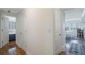Hallway with hardwood flooring leading to rooms with bright windows and shutter blinds at 2479 Peachtree Ne St # 1414, Atlanta, GA 30305