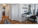 Home office and hallway featuring hardwood floors, built in shelves, and a comfortable workspace at 2479 Peachtree Ne St # 1414, Atlanta, GA 30305