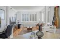 Bright living room with hardwood floors, shuttered windows, and a comfortable seating area at 2479 Peachtree Ne St # 1414, Atlanta, GA 30305