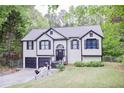 Charming two-story home featuring a well-maintained yard and a convenient two-car garage at 405 Settlers Ridge Ln, Hiram, GA 30141