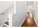 Hallway with hardwood floors and a staircase that has wooden handrails at 786 Brookside Parc Ln, Avondale Estates, GA 30002