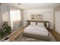 Staged bedroom with comfortable furnishings and natural light. (Virtually Staged) at 485 Sherman Way, Decatur, GA 30033
