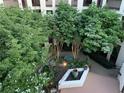 Beautiful courtyard featuring lush greenery, mature trees, and garden at 485 Sherman Way, Decatur, GA 30033