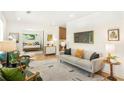 Bright living room with hardwood floors, modern furniture, and stylish decor at 1042 Oakdale Se Dr, Smyrna, GA 30080