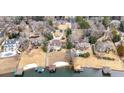 Aerial view showcasing neighborhood properties with lake access, including private boat docks at 3167 Bay View Dr, Jonesboro, GA 30236