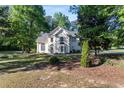 Charming two-story home with a well-manicured lawn and mature trees at 120 Julia Ct, Fayetteville, GA 30214