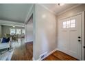 View of entryway with hardwood floors, light gray walls, and open sightlines to other rooms at 1399 Pollard Sw Dr, Atlanta, GA 30311