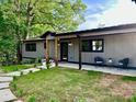Charming single-story home with a walkway leading to the covered front door at 4901 Prince Se Rd, Smyrna, GA 30082