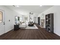 Bright and spacious living room with wood floors, stylish furniture, and a decorative stone fireplace at 1721 Hortense Nw Pl, Atlanta, GA 30318