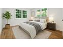 Cozy bedroom with natural light, neutral colors, and hardwood floors at 2590 Eastwood Dr, Decatur, GA 30032