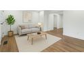 Bright living room features hardwood floors, neutral paint, and a large window at 2590 Eastwood Dr, Decatur, GA 30032