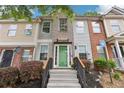 Inviting townhome with a well-kept lawn, colorful front door, and a cozy curb appeal at 2864 Vining Ridge Ter, Decatur, GA 30034
