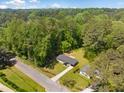 An aerial view of the property reveals its mature tree coverage and proximity to adjacent homes at 2340 Cresta Dr, Decatur, GA 30032