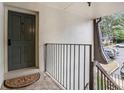Inviting entryway with modern railing leading to the condo entrance numbered 122 at 122 Maison Nw Pl, Atlanta, GA 30327