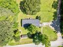 Aerial view of the home's roofline surrounded by lush greenery and a spacious yard showcasing the property's privacy at 170 White Rose Ln, Temple, GA 30179