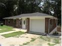 Charming single-story home with an attached garage and well-maintained exterior features at 273 Chicamauga Sw Ave, Atlanta, GA 30314