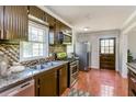 Well-equipped kitchen with stainless steel appliances, and tile backsplash, ready for cooking and entertaining at 5702 Forest Dr, Acworth, GA 30102