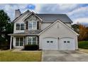 Beautiful two-story home with stone accents, complemented by a well-manicured lawn at 5635 Cedar Pass, Fairburn, GA 30213