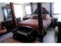 Opulent main bedroom showcasing a four-poster bed and elegant furnishings at 255 Deer Run Rd, Ellenwood, GA 30294
