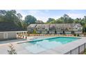 Community pool with ample deck space for lounge chairs and relaxation at 339 Elgin Dr, Lawrenceville, GA 30045