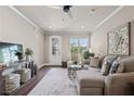 Cozy living room with plush seating, ceiling fan, and an open layout perfect for relaxation at 5128 Noble Village Way # 35, Lilburn, GA 30047