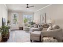 Stylish living area with modern decor, a comfortable sectional, and bright natural light at 5128 Noble Village Way # 35, Lilburn, GA 30047