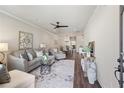 Sunlit living room features hardwood floors and a comfortable seating area with stylish decor at 5128 Noble Village Way # 35, Lilburn, GA 30047