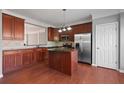 Stylish kitchen featuring stainless steel appliances, granite countertops, and center island at 1530 Wehunt Se Cir # 19, Smyrna, GA 30082