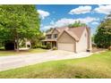 A view of a home's exterior from the side, highlighting its well-maintained yard and attached garage at 2055 Springer Walk, Lawrenceville, GA 30043