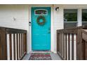 Close up of a vibrant blue front door with wreath, complementing the house's welcoming exterior at 831 Catherine St, Forest Park, GA 30297