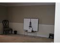 Relaxing room with an Eiffel Tower, a chair and neutral tones perfect for unwinding after a long day at 8871 Jimmy Lee Cir, Jonesboro, GA 30238