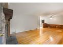 Cozy living room featuring hardwood floors and a classic brick fireplace at 2783 Mount Olive Dr, Decatur, GA 30033