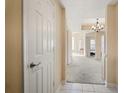 View of the hallway into the living room with beige walls and carpet, and white doors and ceilings at 1250 Parkwood Se Cir # 300, Atlanta, GA 30339