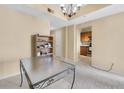 Open living room and kitchen view with lots of light, neutral colors, and a dining table at 1250 Parkwood Se Cir # 300, Atlanta, GA 30339