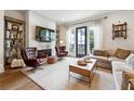 Cozy living room boasts a fireplace with a mounted TV, stylish furnishings, and ample natural light at 3667 Peachtree Ne Rd # 6, Atlanta, GA 30319