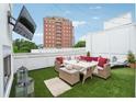 Inviting rooftop patio featuring comfortable seating, a television, and city views for outdoor entertainment at 3667 Peachtree Ne Rd # 6, Atlanta, GA 30319