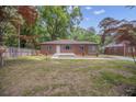 A beautiful brick home featuring a newly landscaped front yard and concrete entryway at 1528 Alder Sw Ln, Atlanta, GA 30311