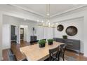 Dining room with contemporary lighting fixtures, trim accents, and neutral-toned walls at 1628 Baytree Dr, Cumming, GA 30040