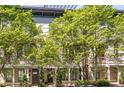 Beautiful exterior view of a townhome, featuring lush trees and a private balcony at 175 Stovall Se St, Atlanta, GA 30316