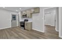 Modern kitchen with stainless appliances, including range and microwave, stylish cabinets, and neutral paint at 2017 Allwood Ct, Lawrenceville, GA 30044