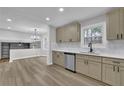 Updated kitchen with stainless appliances, quartz countertops and dining area, flowing into the living room at 2017 Allwood Ct, Lawrenceville, GA 30044