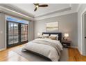Serene bedroom with a balcony, hardwood floors, and plenty of natural light at 850 Piedmont Ne Ave # 2509, Atlanta, GA 30308