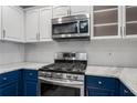 Close up of kitchen featuring stainless steel gas range, microwave, and marble counters at 850 Piedmont Ne Ave # 2509, Atlanta, GA 30308