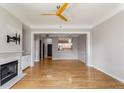 Spacious living room with fireplace, hardwood floors, and open layout to kitchen at 850 Piedmont Ne Ave # 2509, Atlanta, GA 30308