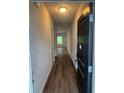 Inviting entryway with hardwood floors and a view into the open-concept living area at 6424 Rosetta Dr, South Fulton, GA 30331