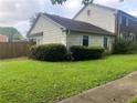 This single-story home is sided with clapboards and sits on a small lot with healthy green grass at 2617 Terrace Pkwy, Morrow, GA 30260
